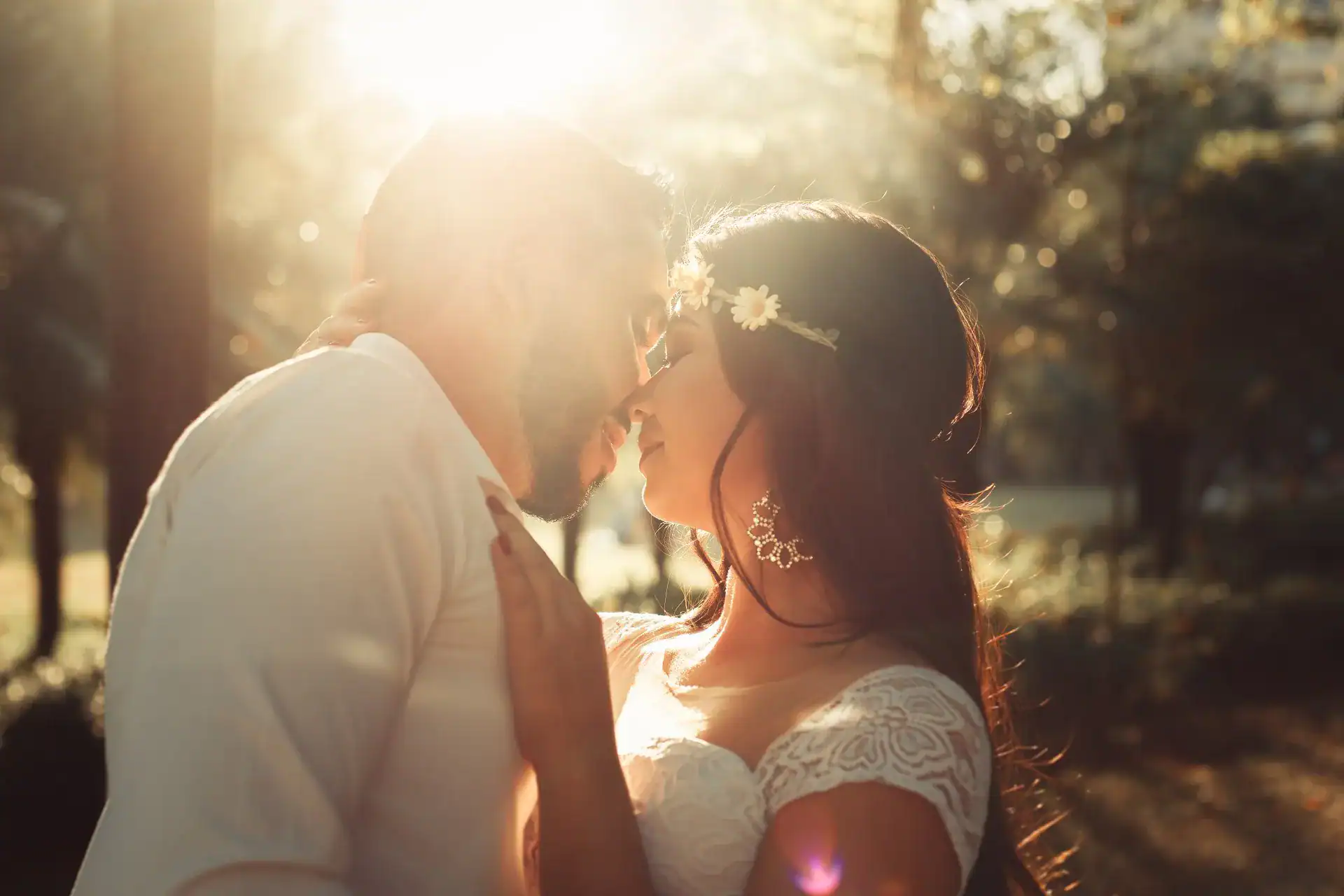 Beautiful couple illuminated by different style lighting at a wedding.