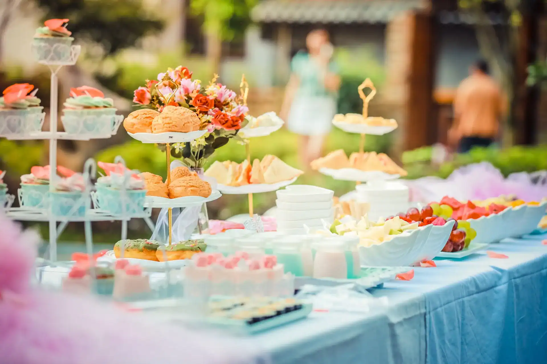 Elegant wedding food table with desserts and appetizers for perfect celebration.