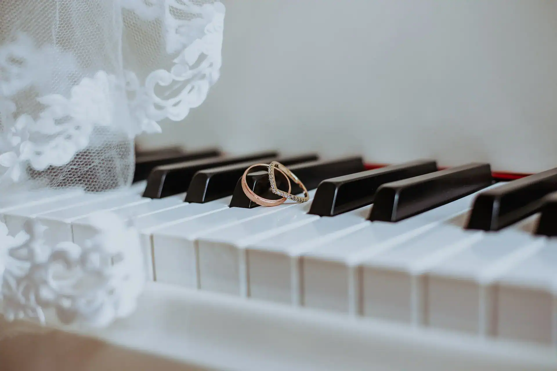 Wedding music piano with rings on keys.